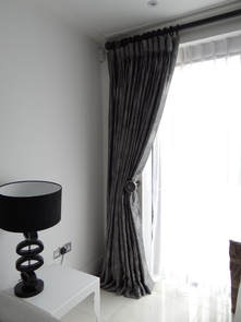 Fabric curtains and sheer curtains by french windows